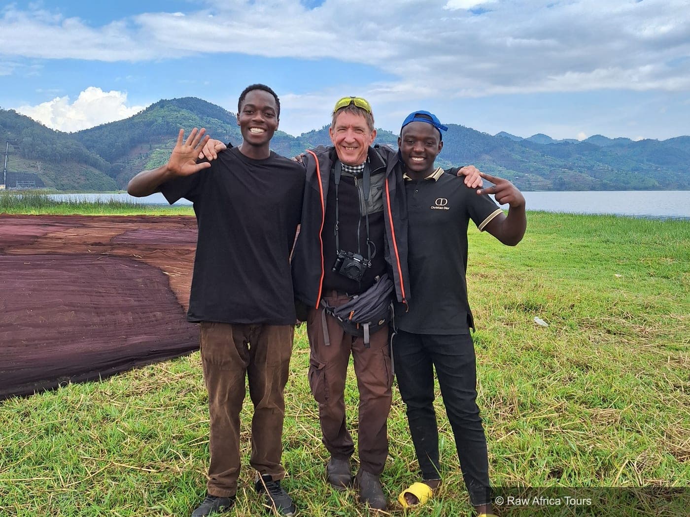 Jason Donovan with local guides on the shores of Lake Kivu, Rwanda