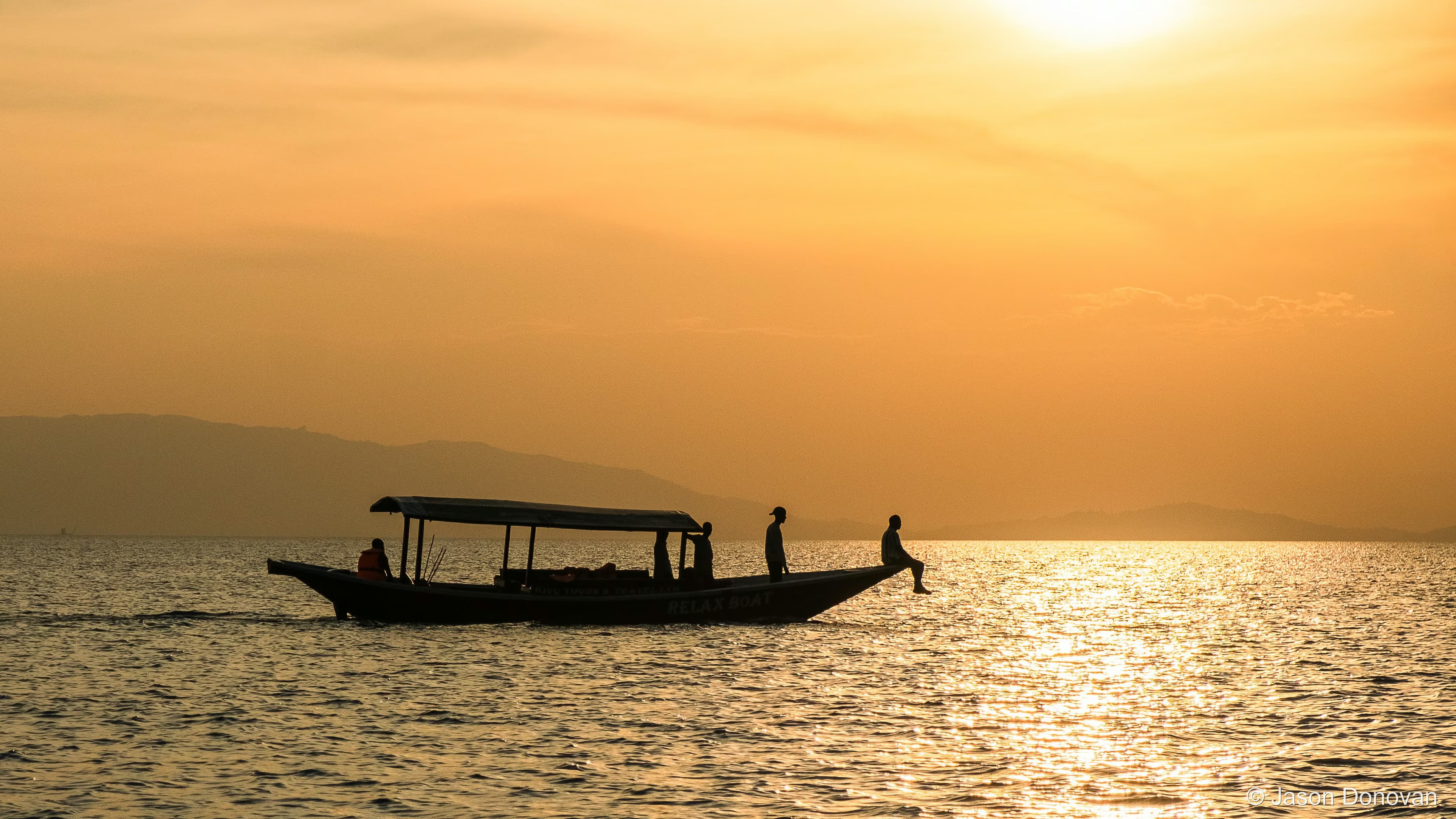 Locals heading home at sunset Rwanda photography by Jason Donovan